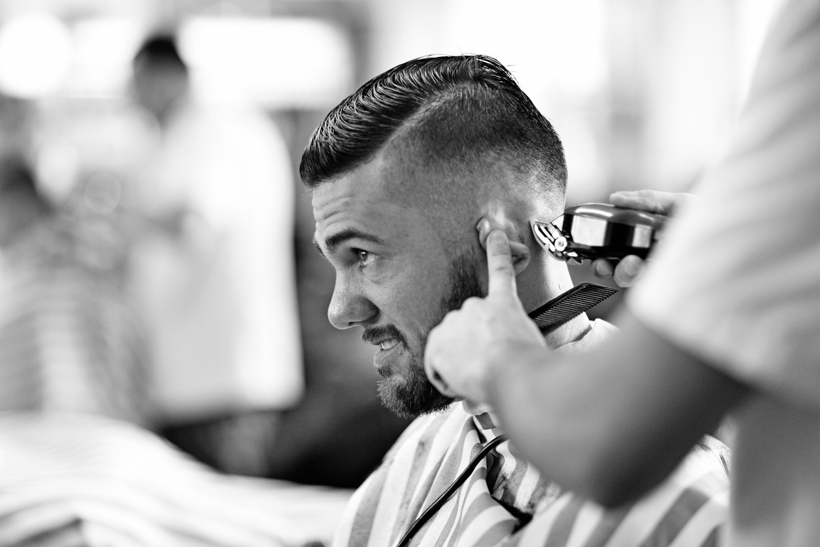 client getting shaved at barbershop