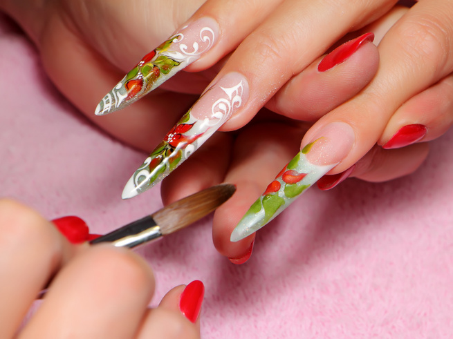 Painting acrylic nails.